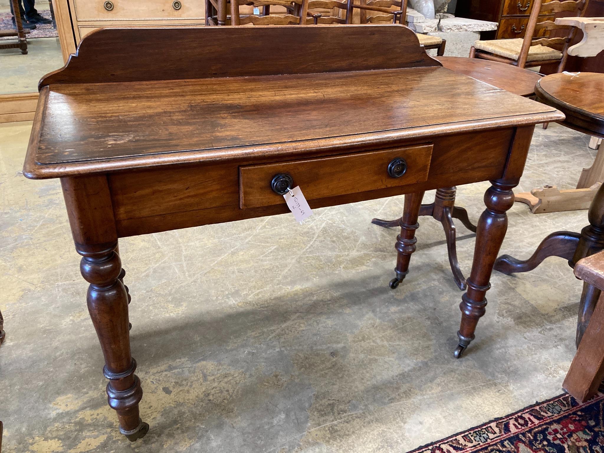 A Victorian mahogany writing table